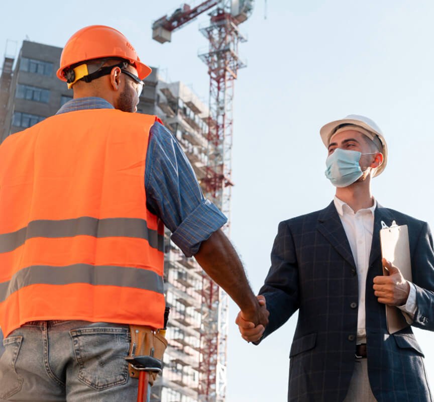 Two Construction Site workers Shaking Hands