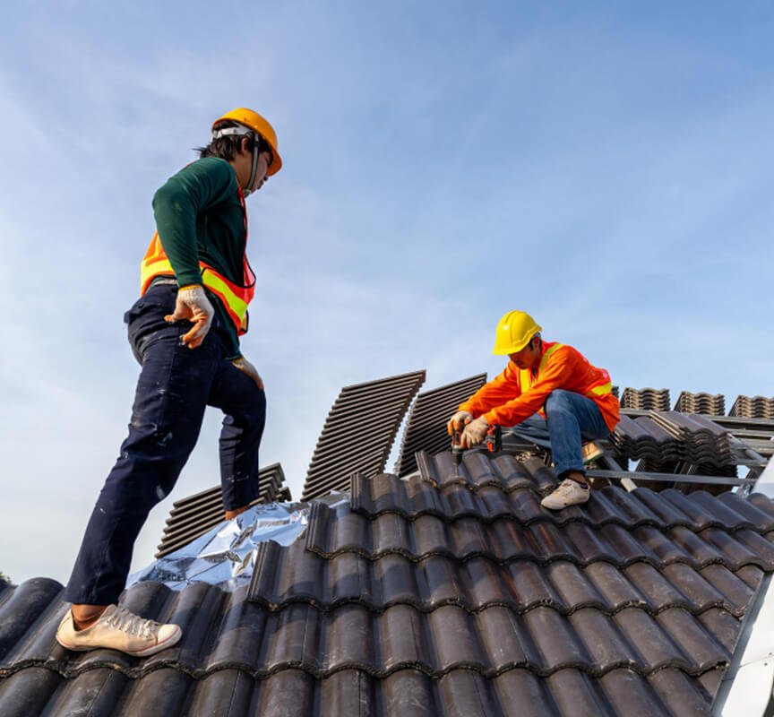 Two man shaping the roof top.